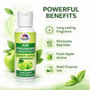 Air freshener concentrate bottle with green apple fragrance, surrounded by green leaves and apples on a white background.